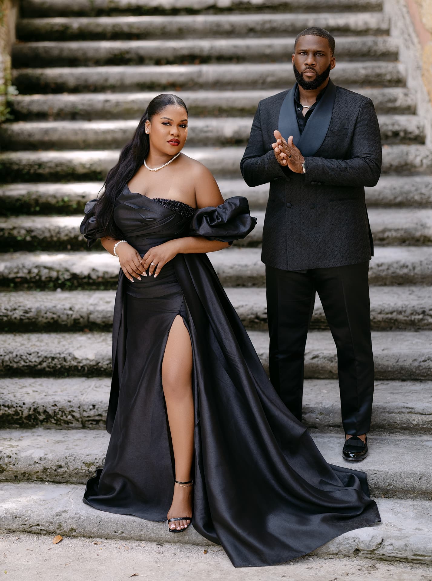 Full-length portrait of the couple on grand stone steps