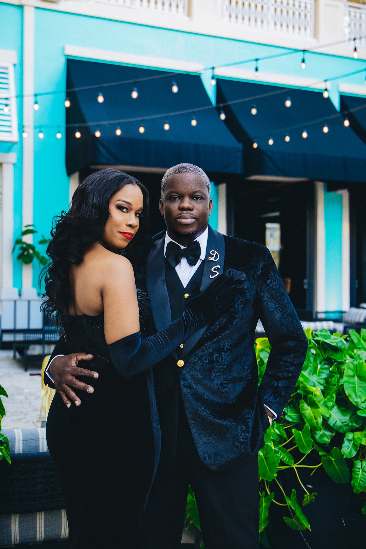 Editorial portrait of the couple in velvet and gloves